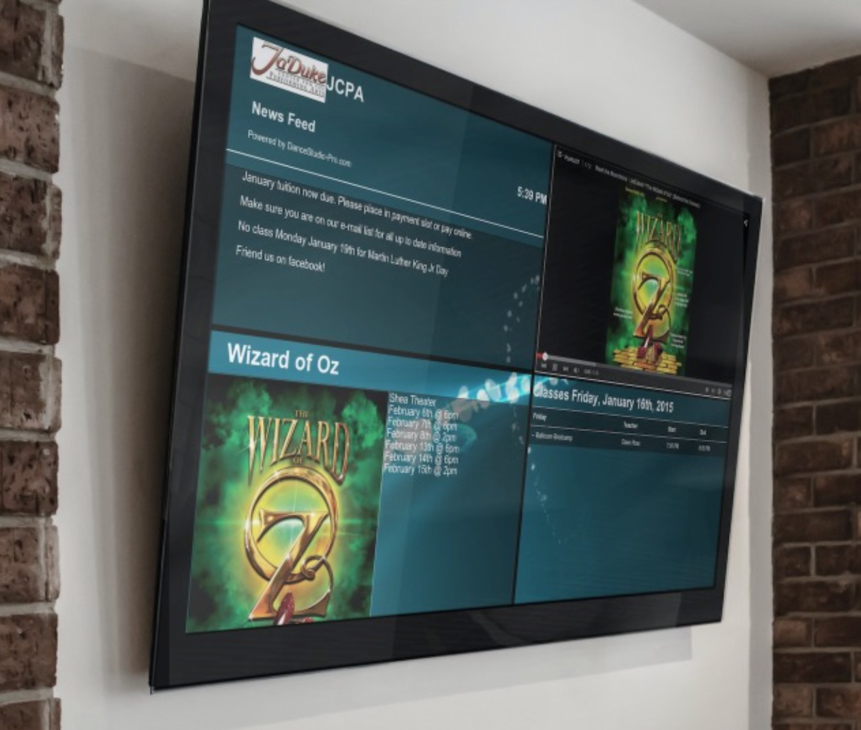 TV screen displaying "Wizard of Oz" info.